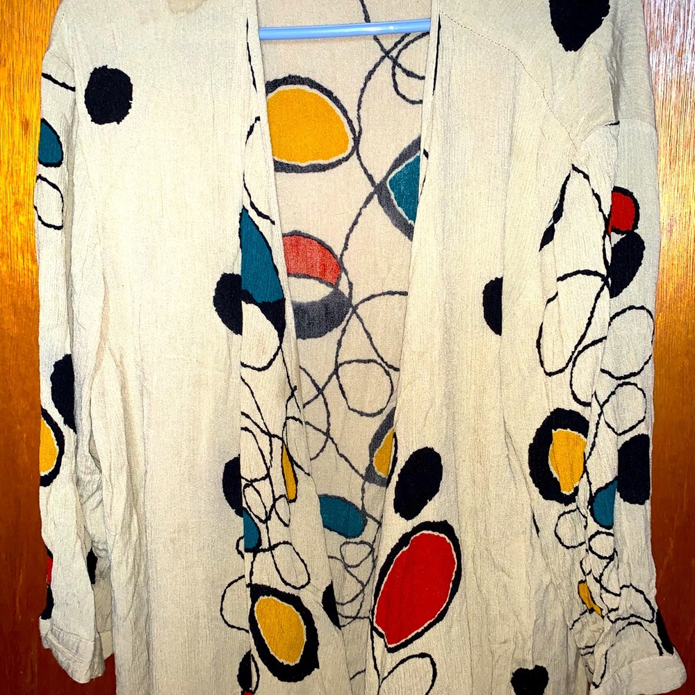Vibrant hangs like a cardigan it’s long.